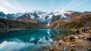 Turquoise Laguna Humantay beneath the snow-capped Salkantay mountain in Peru