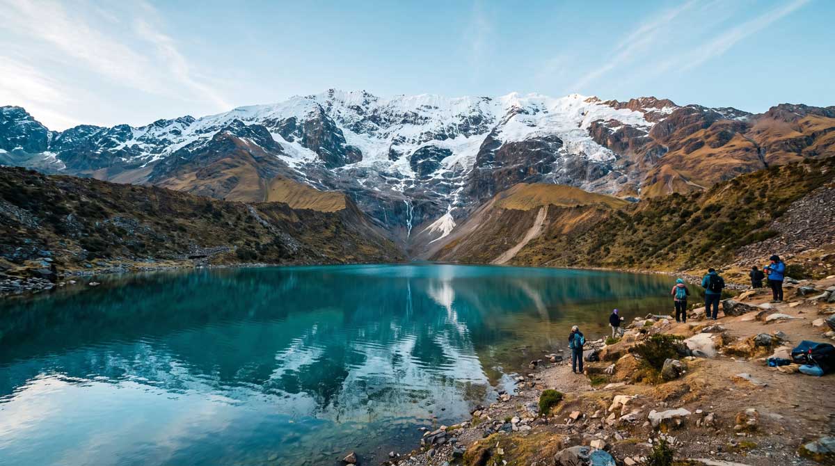 Turquoise Laguna Humantay beneath the snow-capped Salkantay mountain in Peru