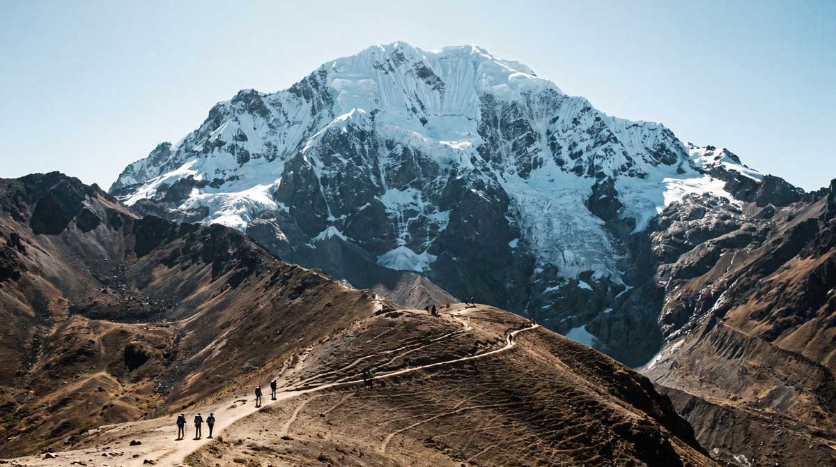Glaciated Salkantay peak above a high mountain trail in Peru