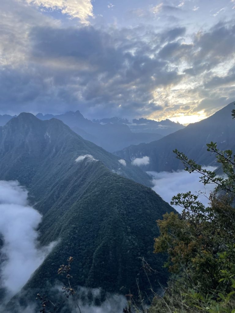 Morning cloud lying in the Urubamba valley as the sun rises over the mountains
